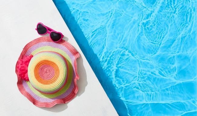 a pool with glasses and a hat