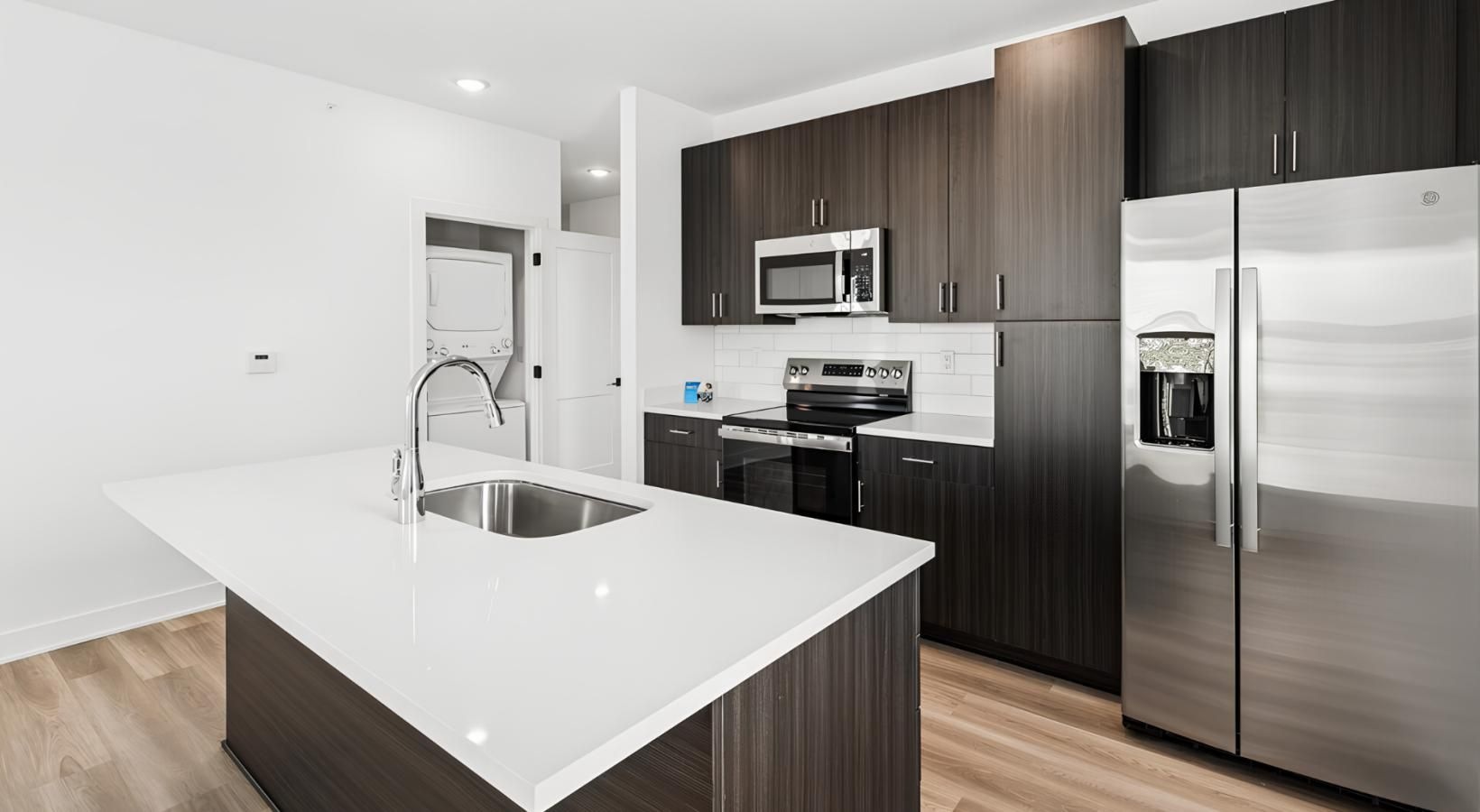 a kitchen with black cabinets